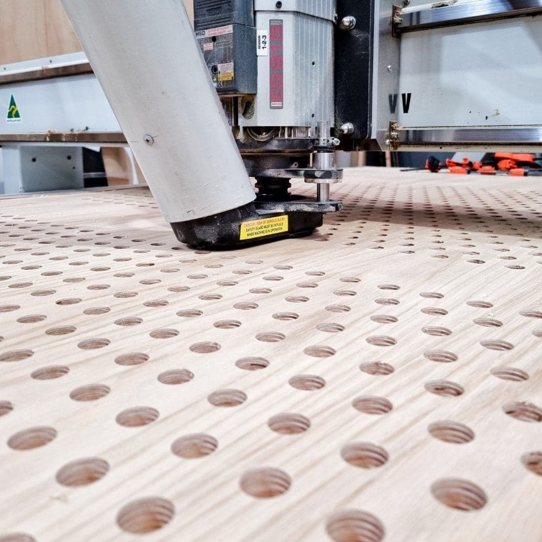 CNC Machine cutting perforated panel